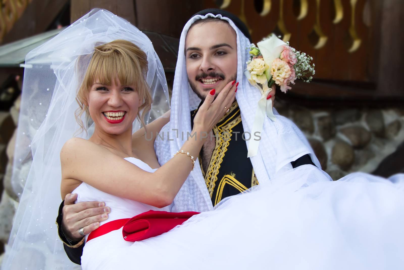 Russia, Moscow, Izmaylovsky Park, August 27, 2017. International Photo Festival.Wedding of an Arab and a Russian woman. Eastern groom and Russian bride