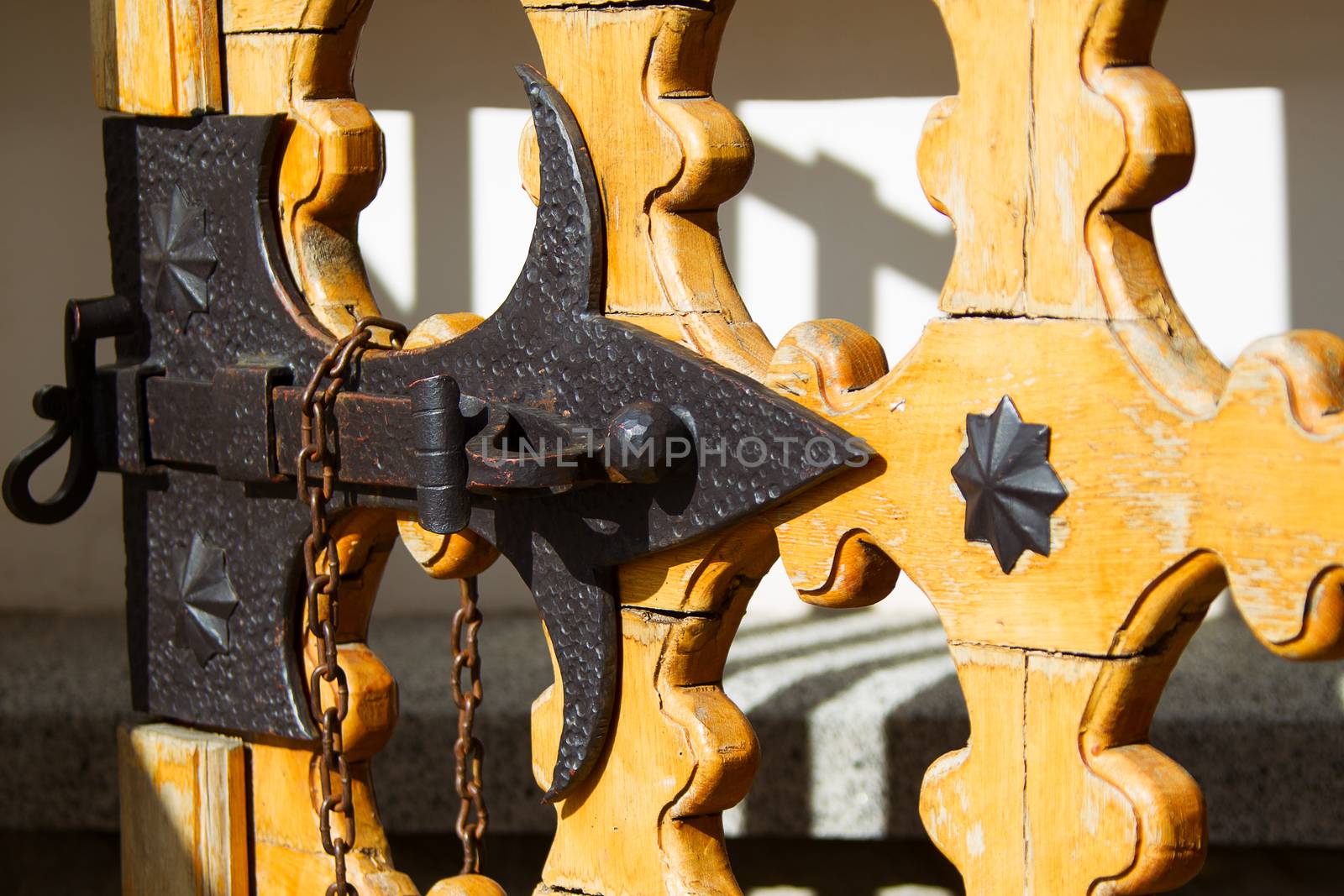 An old bolt. An ancient castle from the door. Retro key. The door bolt is iron historical