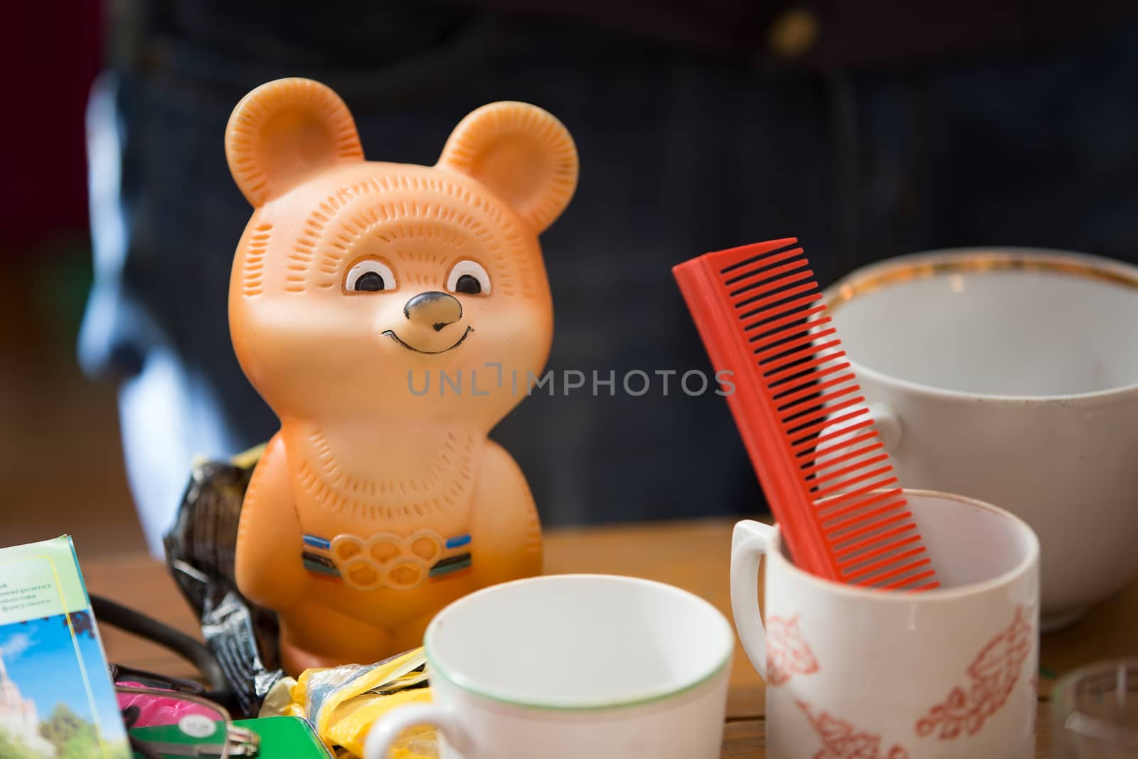 Old Olympic bear. Soviet things. Old cups and a comb.