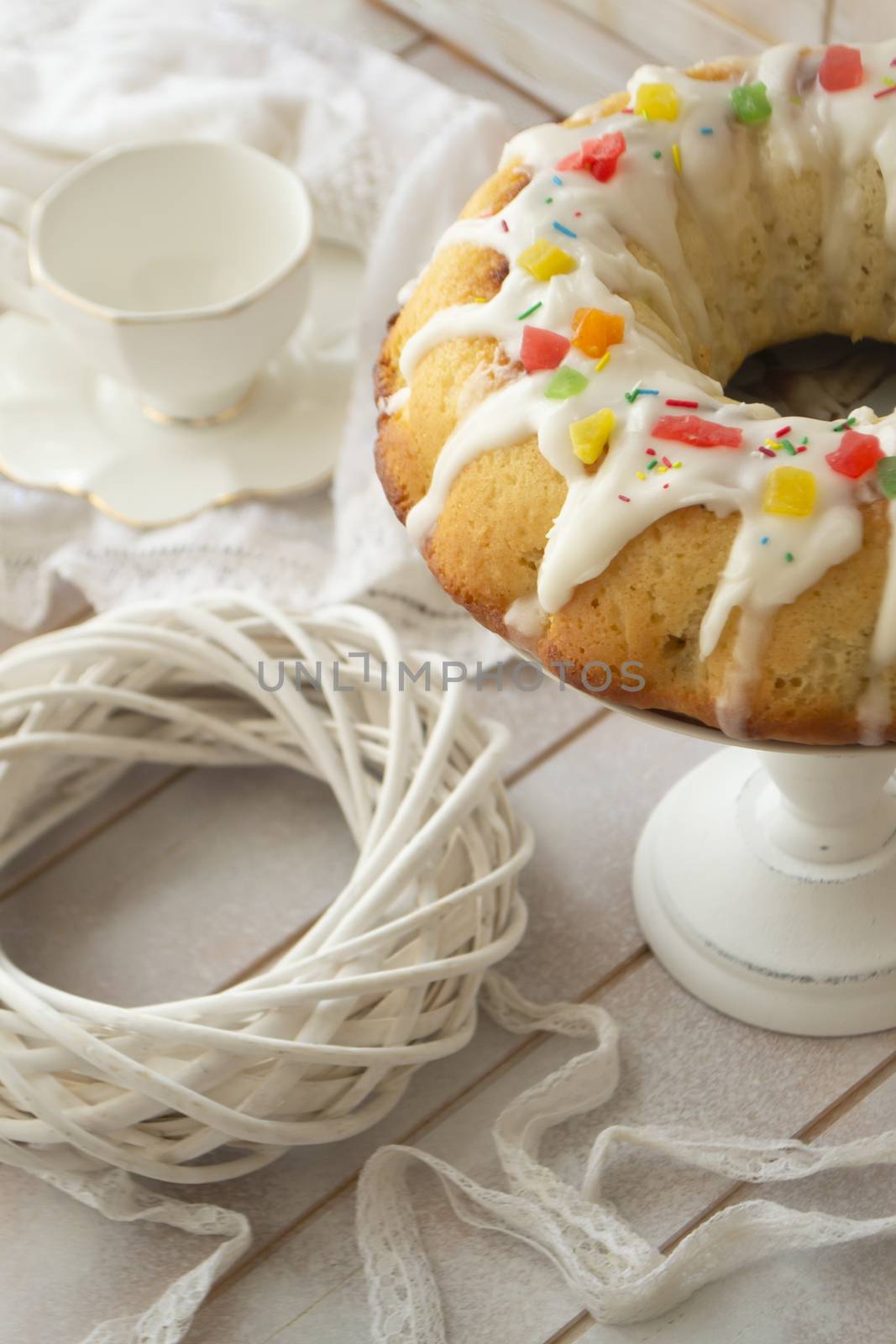 Cake Babka with icing and decoration, vintage pastel image, vertical