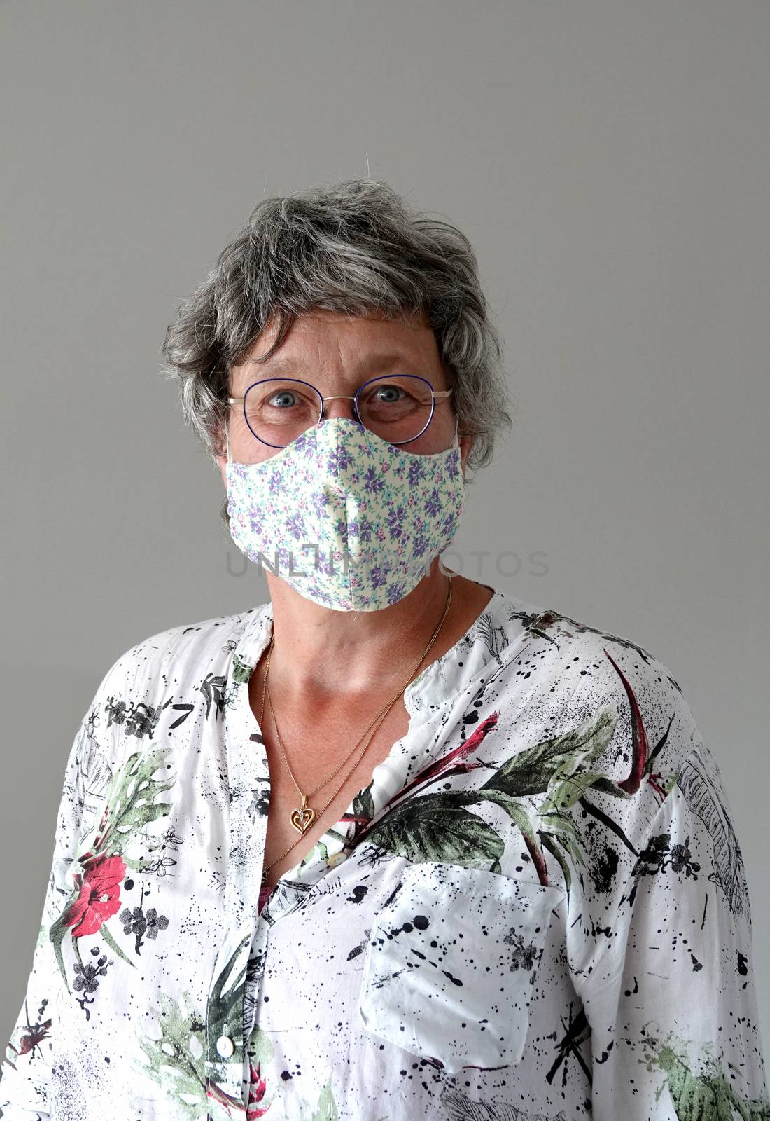 adult woman wearing protection face mask against coronavirus