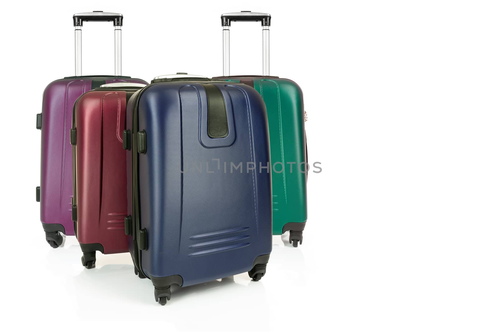 Group of various travel suitcases isolated on a white background