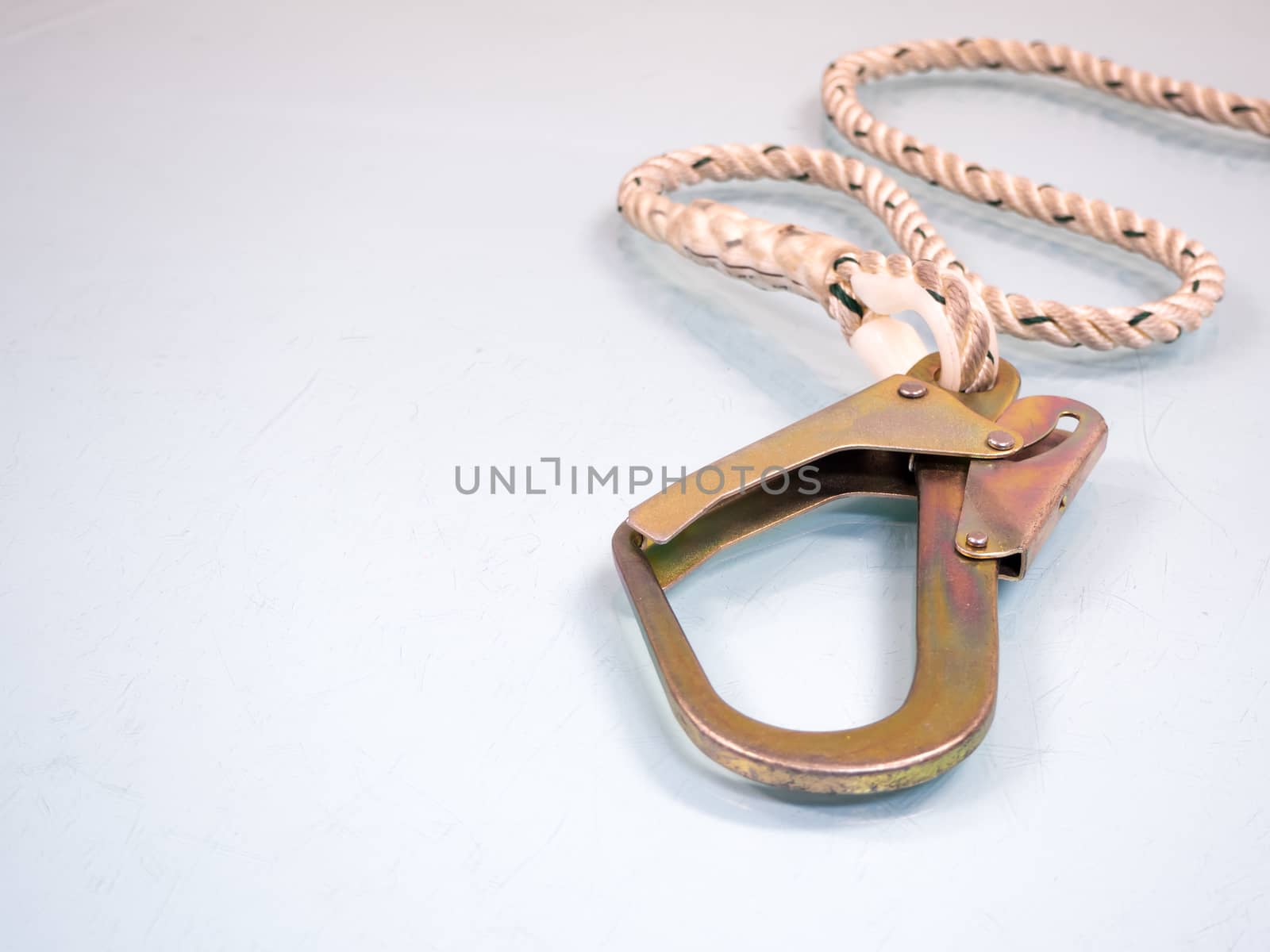 Figure eight knot with carabiner. Silver carabiner with lock andrope isolated on white background.