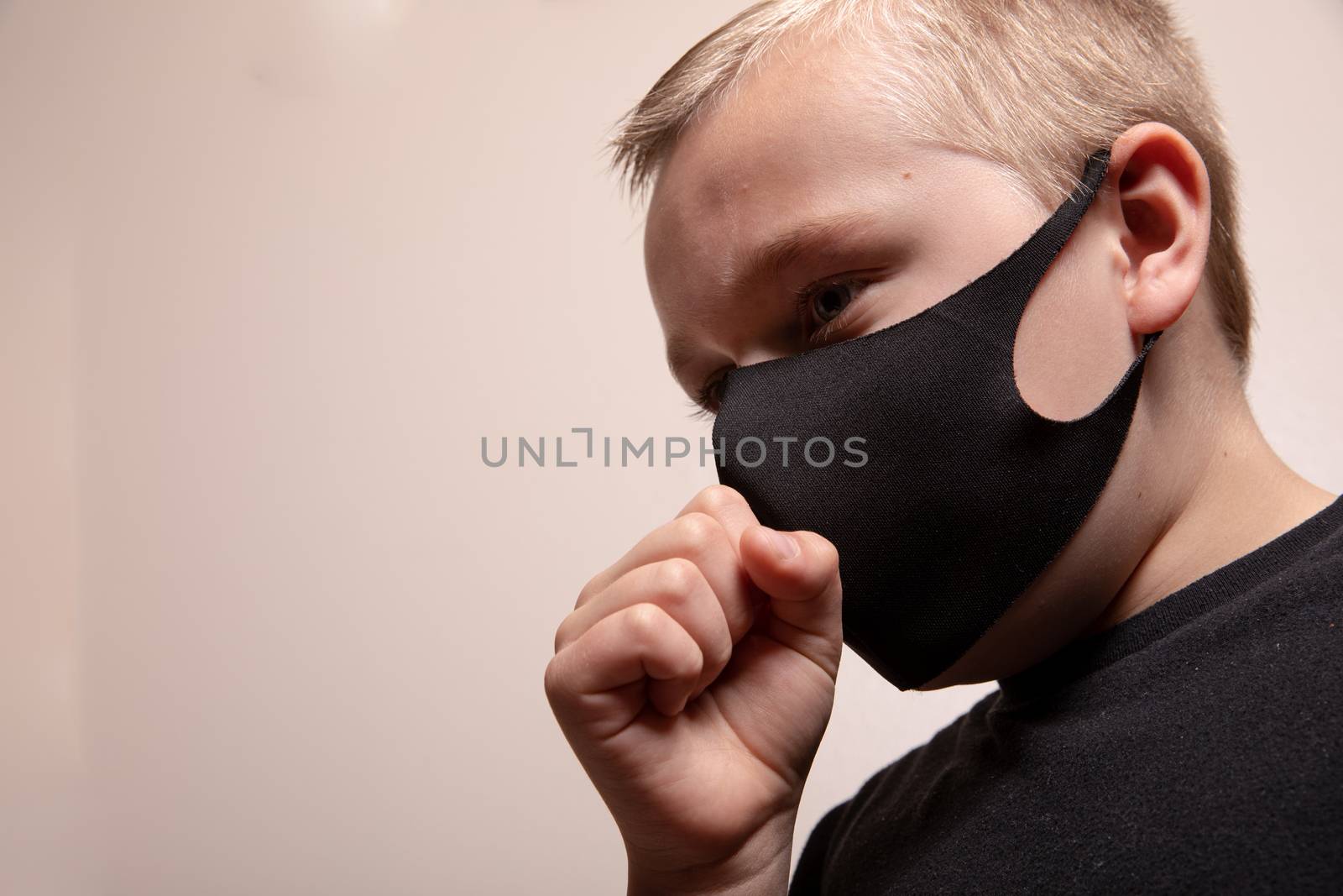 Young boy wearing a mask to help prevent the sprad of disease