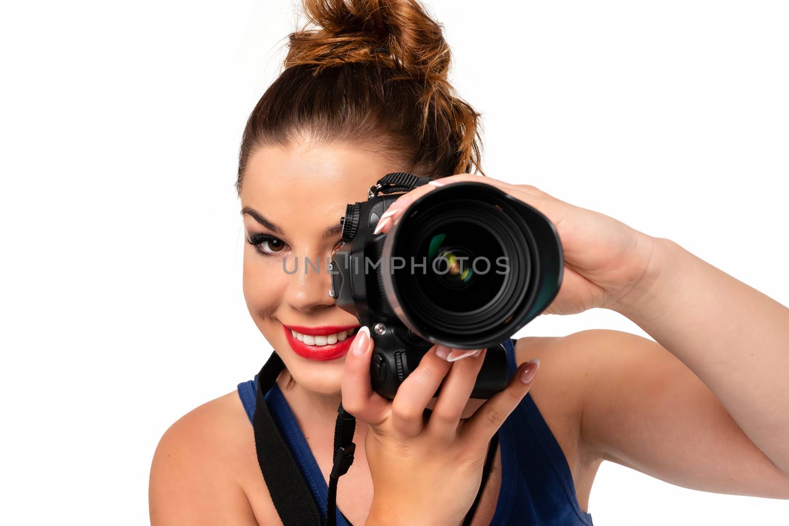 Photographer occupation concept - beautiful and attractive woman holding a professional DSLR camera and smiling