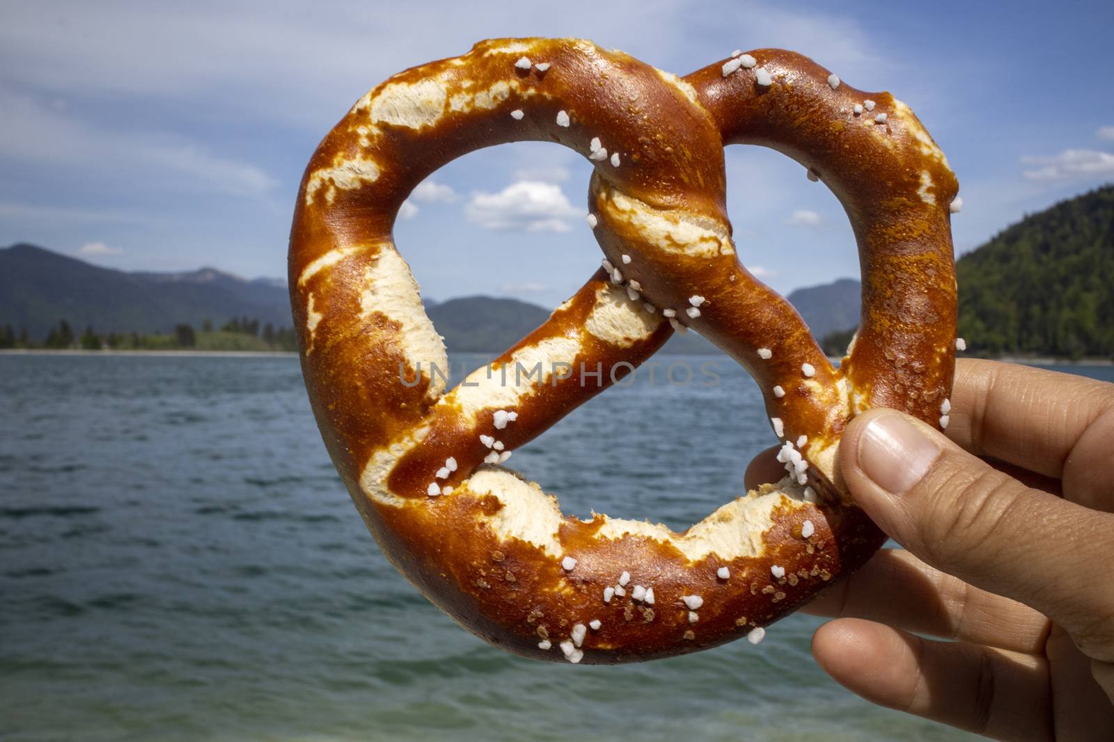 hand holding a pretzel at Walchensee