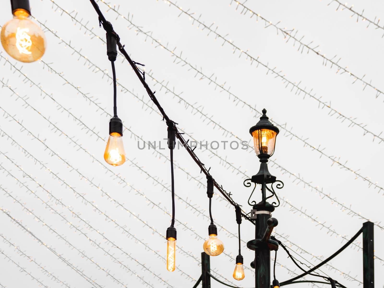 Vintage light bulbs with glower filament. Incandescent retro design. Outdoor decoration for New Year and Christmas celebration. Moscow, Russia.