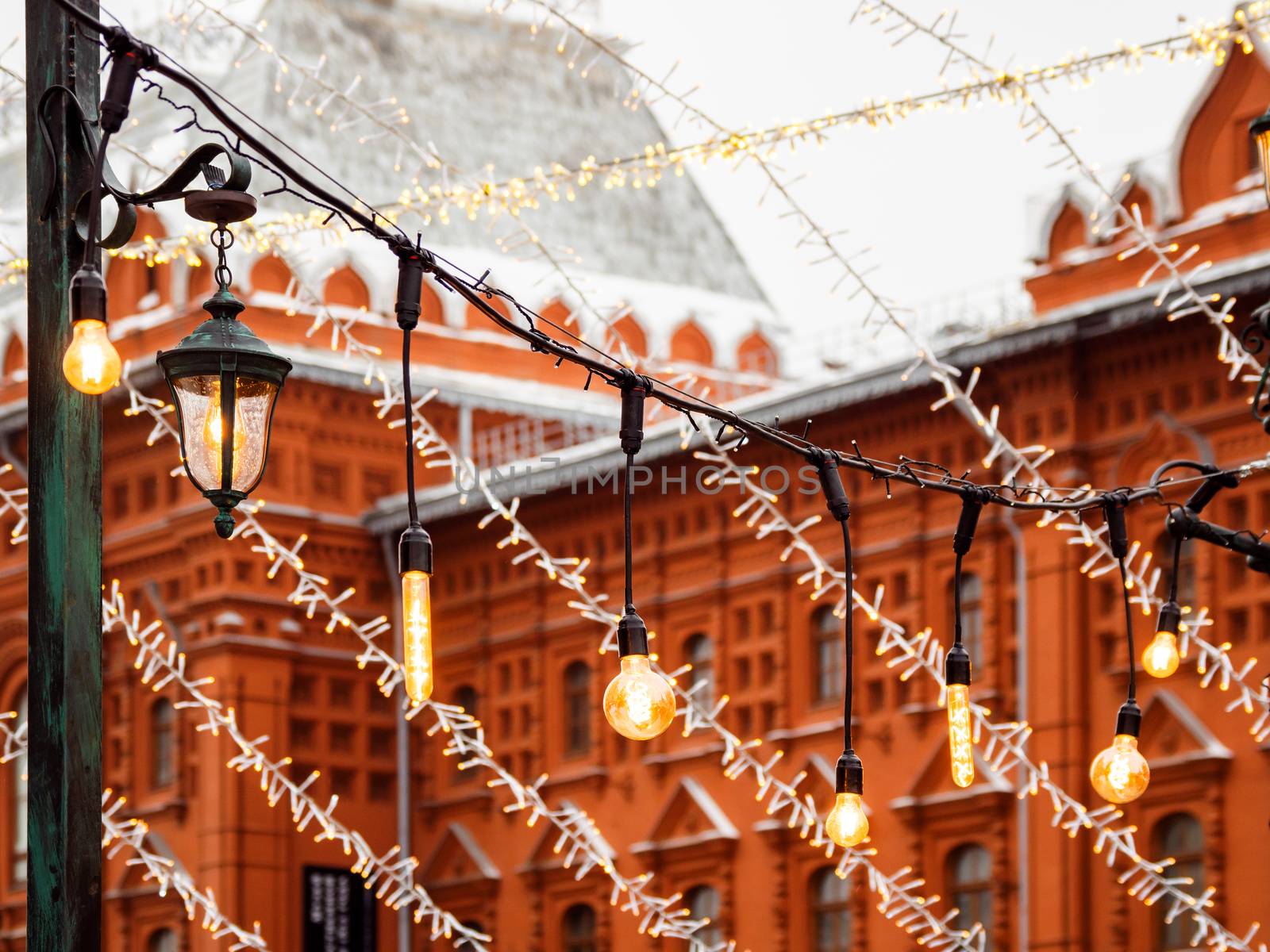 Vintage light bulbs with glower filament. Incandescent retro design. Outdoor decoration for New Year and Christmas celebration. Moscow, Russia.