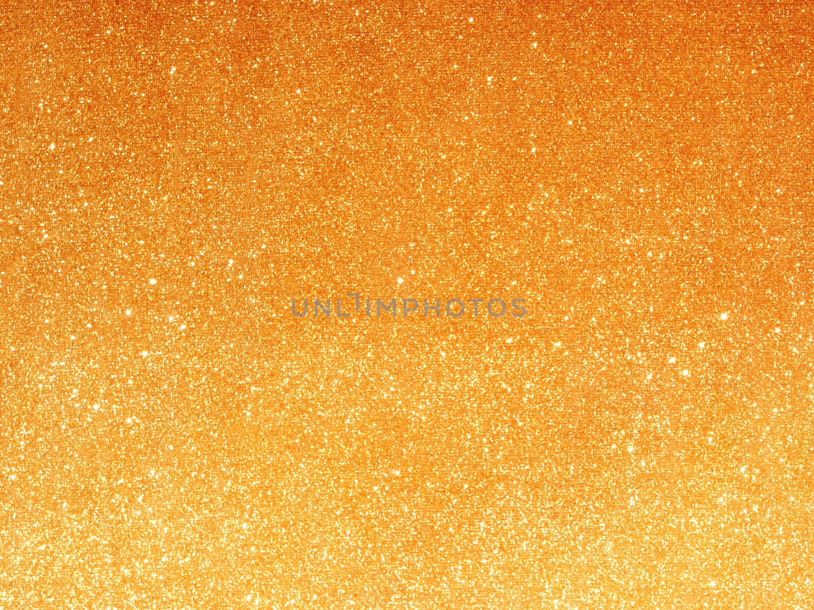Golden fabric background with light reflections.Soft focused luxury holiday background.