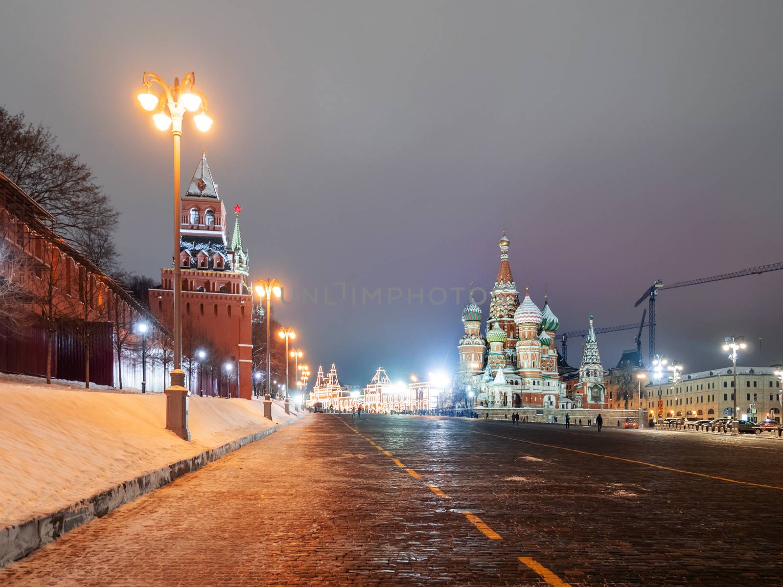 Famous landmarks - St. Basil Cathedral on Red square in Kremlin. Winter evening in Moscow, Russia.