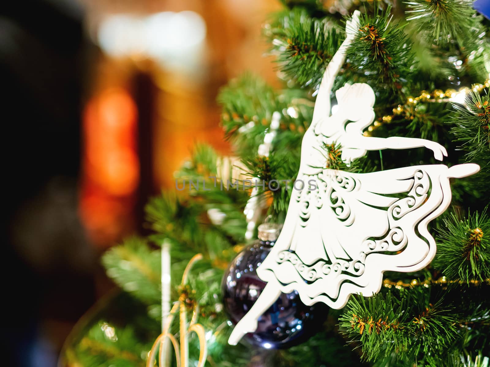 Little graceful ballerina, decorative toy for Christmas tree. Beautiful decoration for New Year celebration.