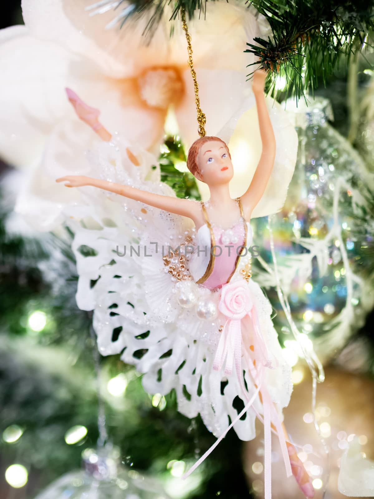 Little graceful ballerina, decorative toy for Christmas tree. Beautiful decoration for New Year celebration.