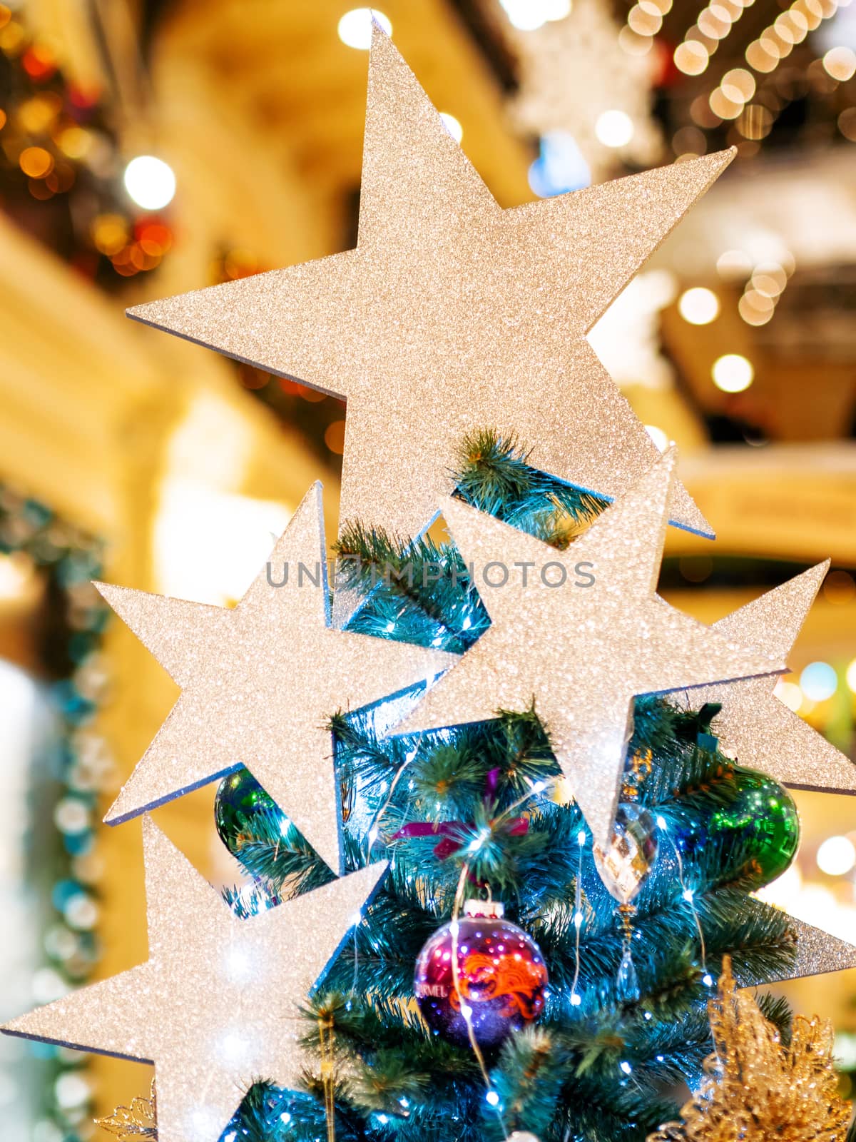 Silver shining stars, made of spangles. New Year decoration for Christmas tree top.