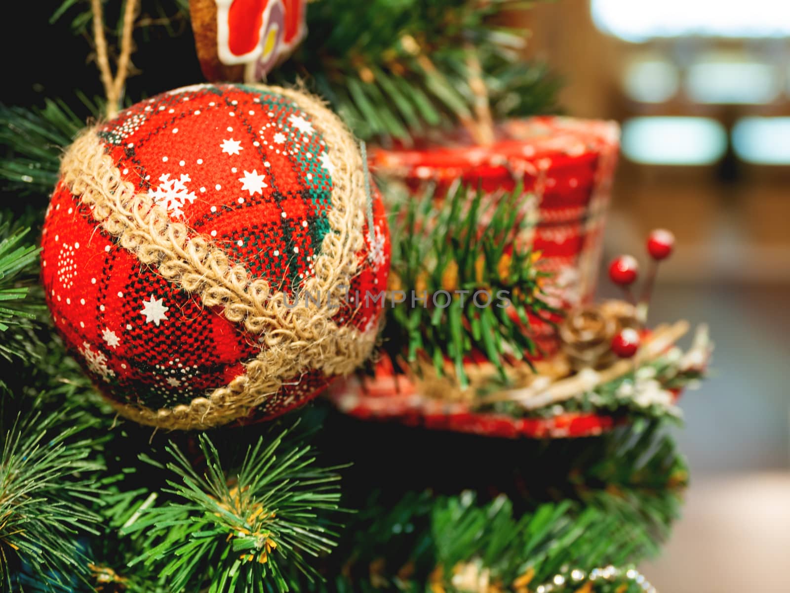 Hand made decoration for Christmas tree. Decoration made of tartan fabric with spangles for New Year celebration.