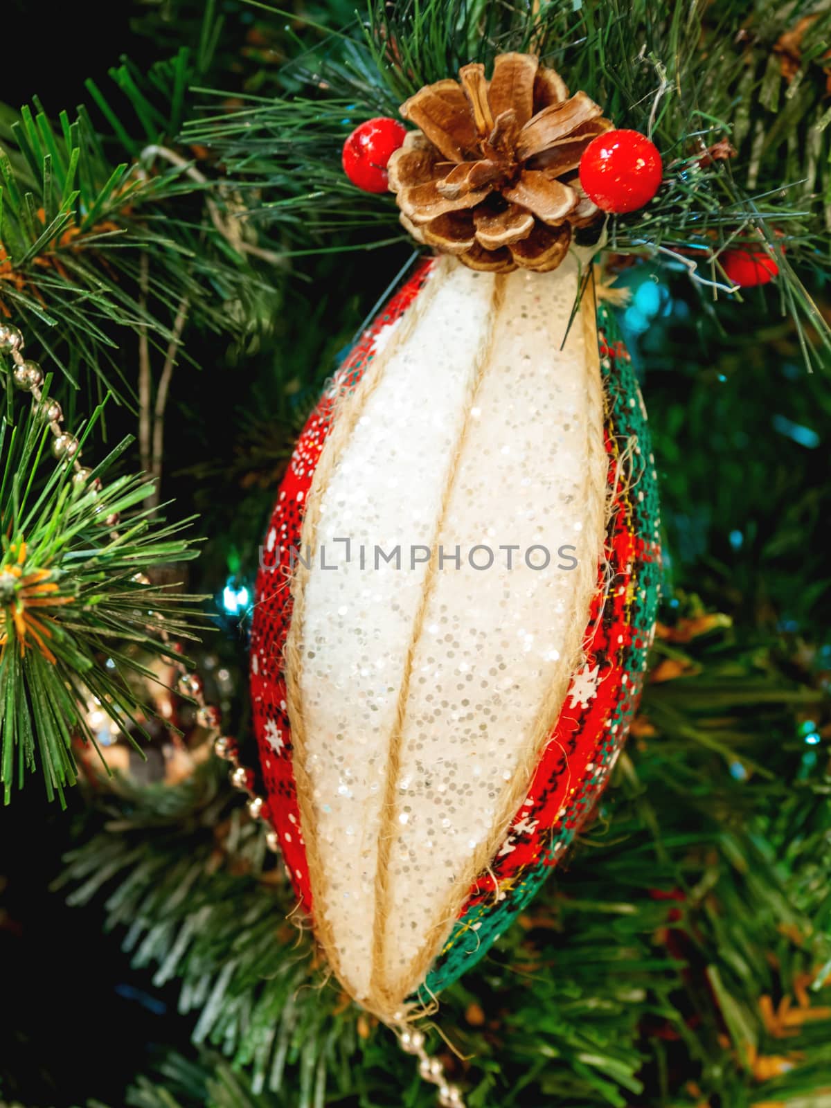 Hand made decoration for Christmas tree. Decoration made of tartan fabric with spangles for New Year celebration. by aksenovko