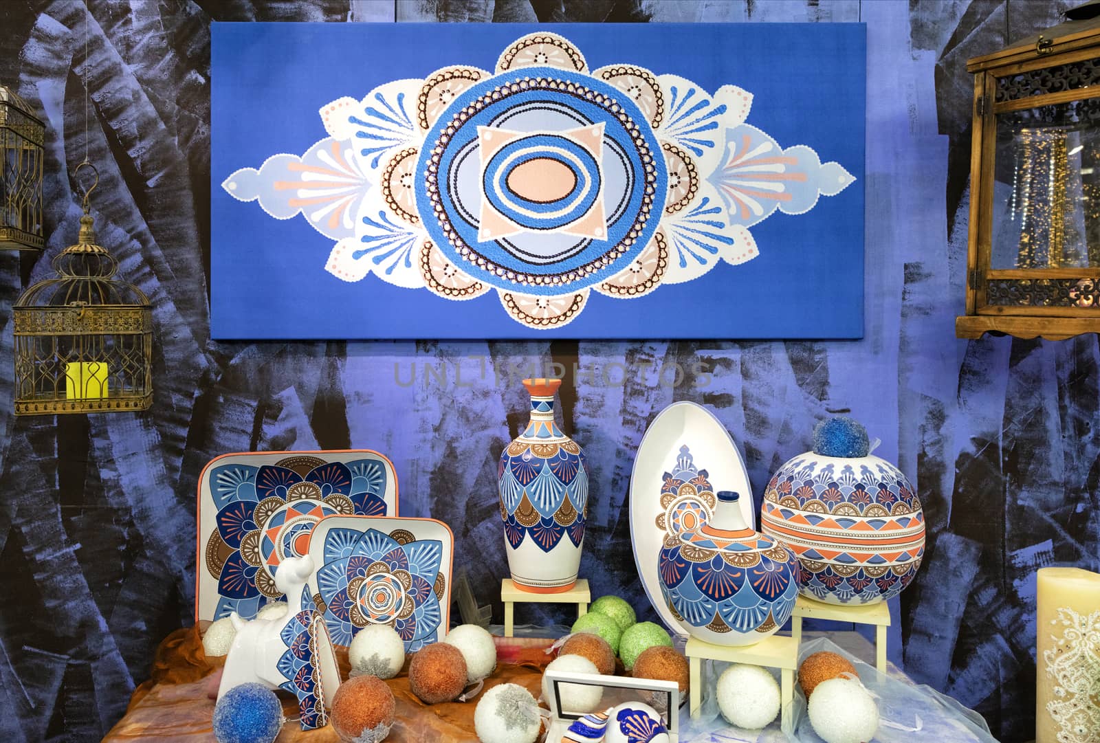 Hand-painted porcelain plates, collection of colorful porcelain pottery, of vases and Christmas toys.