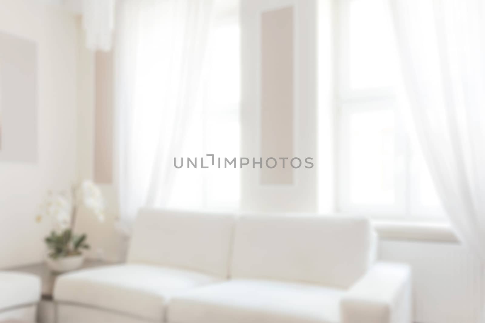 Blurred view of a white and bright luxury apartment or livingroom interior.