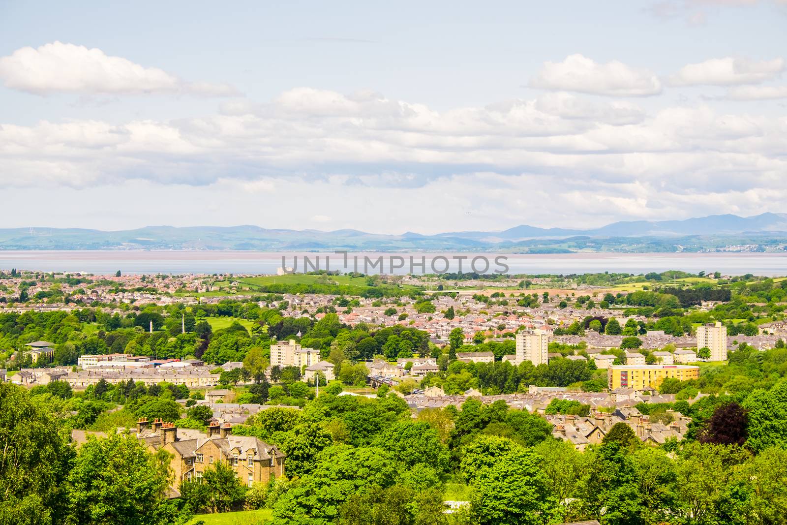 The cityscape of Lancaster, with Morecambe Bay viewed from the Ashton Memorial in Williamson Park. by paddythegolfer