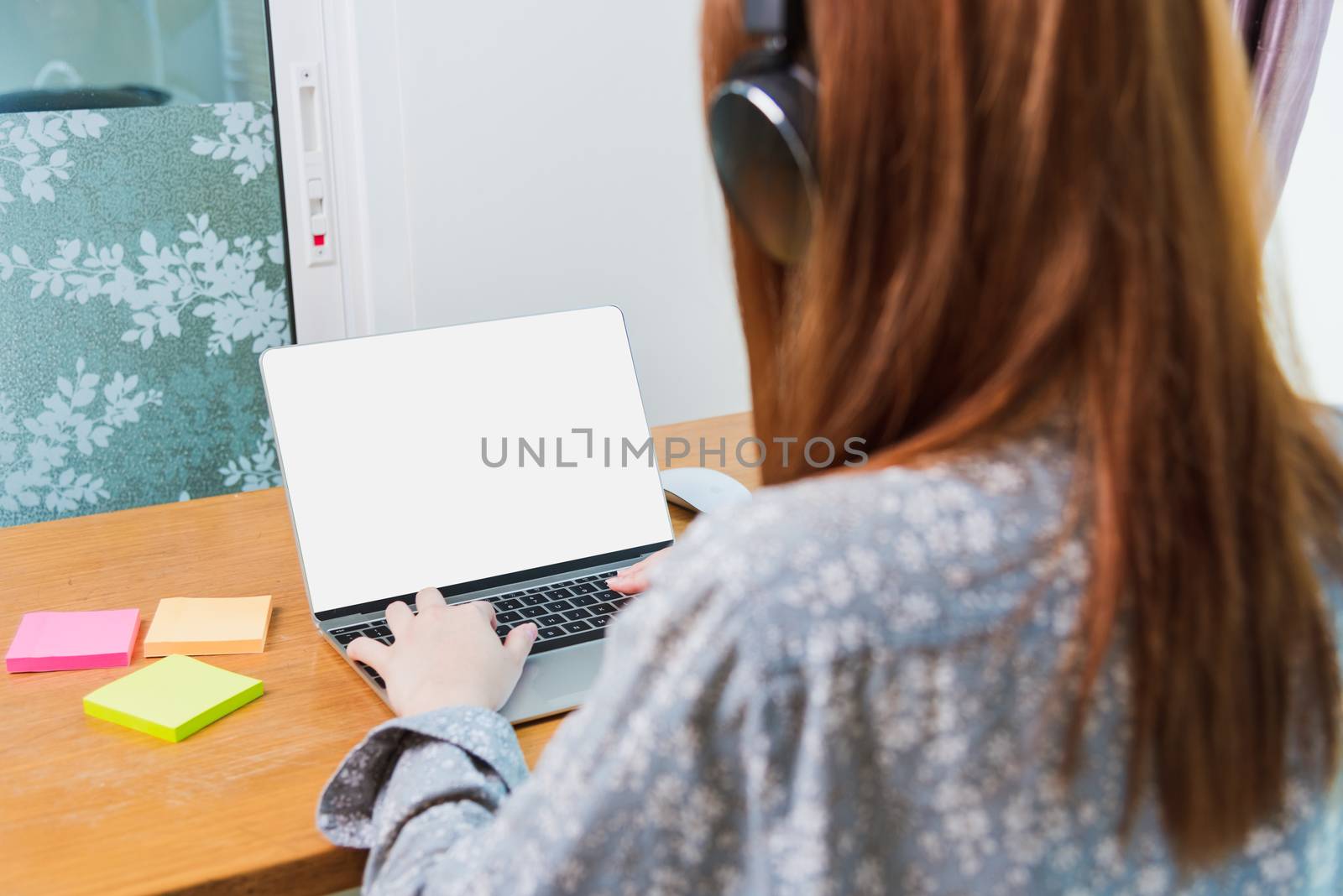 Work from home concept, Happy Asian beautiful young business woman wearing headphone call online conference video call meeting for discussion talking with boos and team together by laptop computer