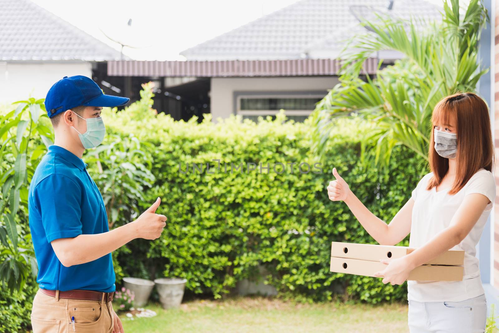 delivery courier young man giving food pizza box to woman custom by Sorapop