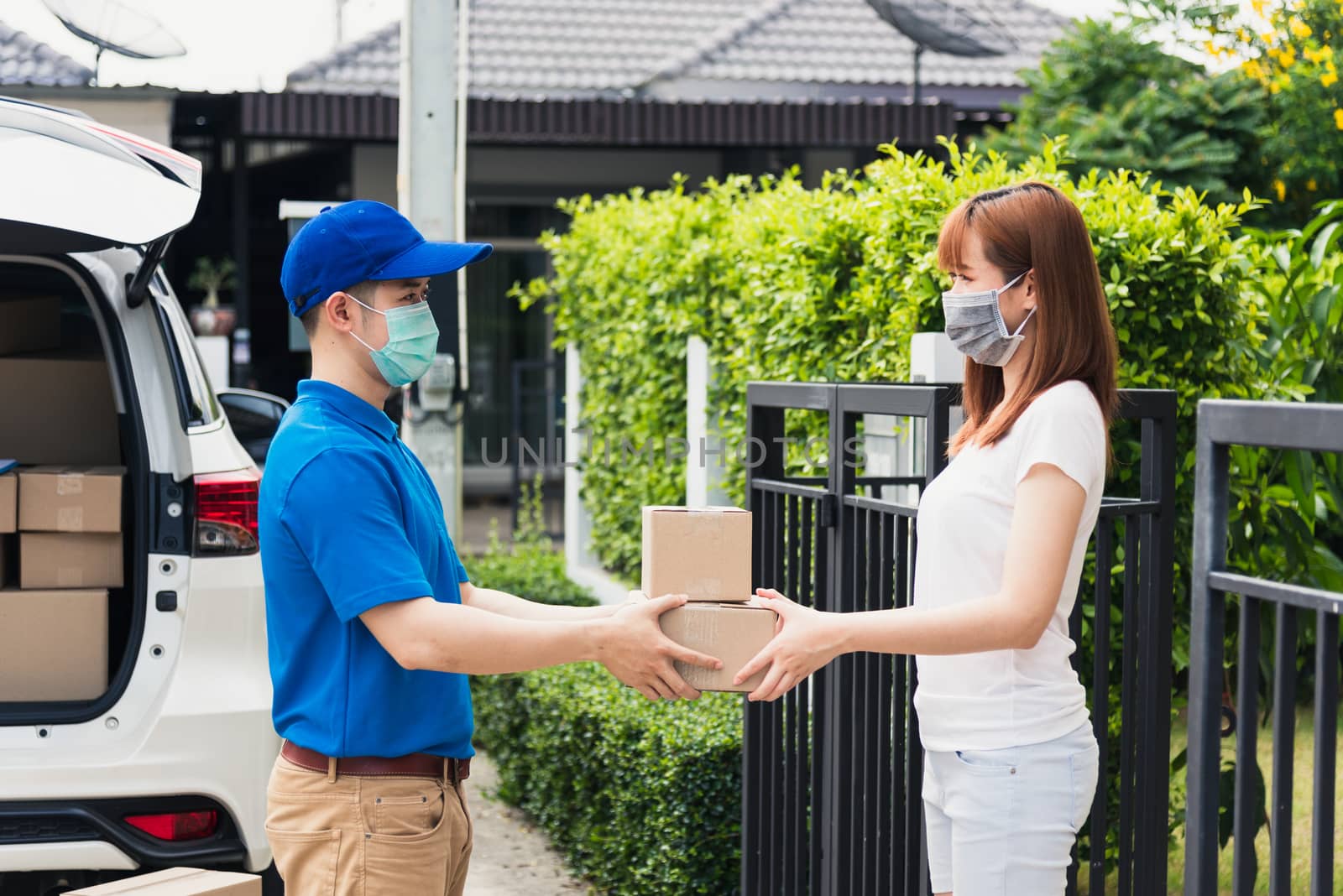 delivery man box he protective face mask service woman customer  by Sorapop