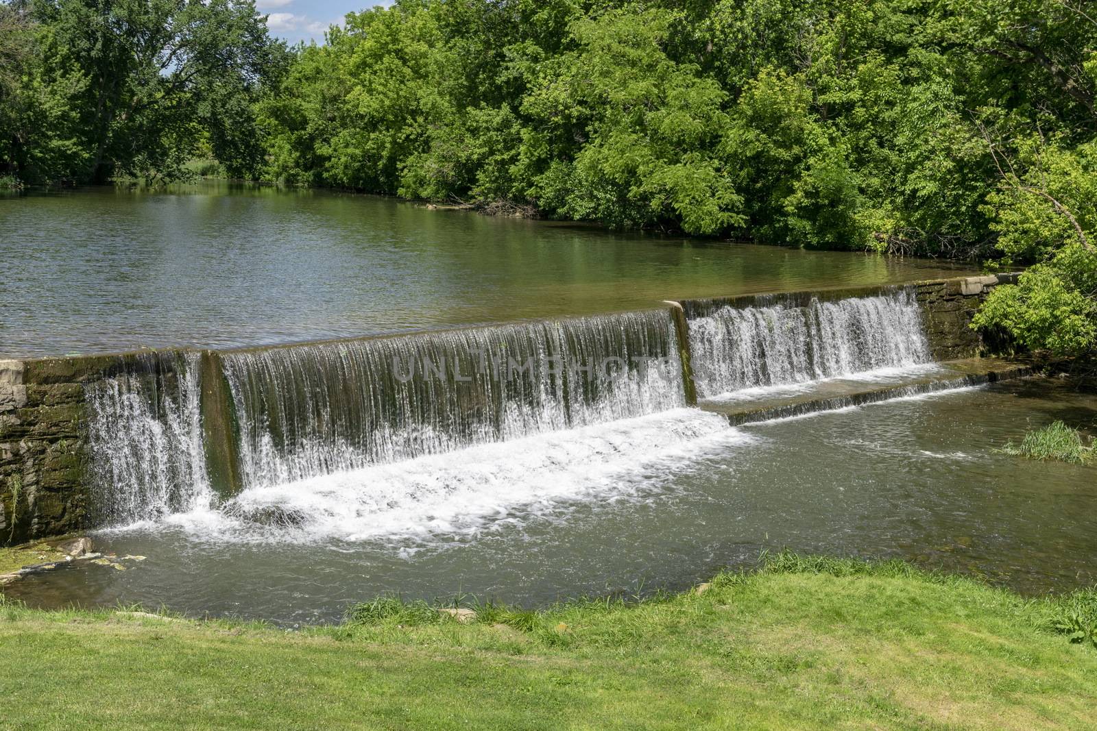 Amish Countryside with a Man Made Waterfall by a Mill