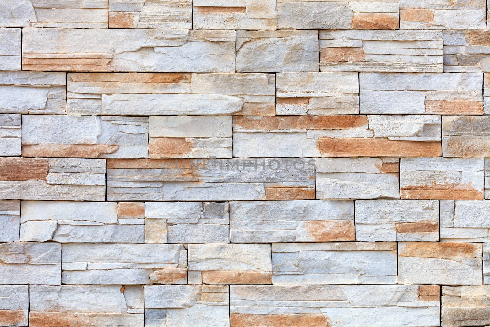 Wall mosaic made of red and beige sandstone tiles by Sergii