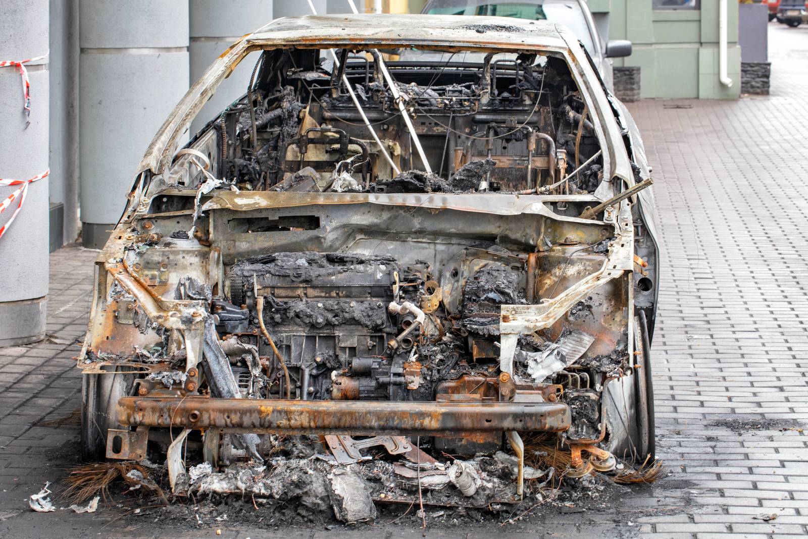 The interior of a burned-out car interior, front view. by Sergii