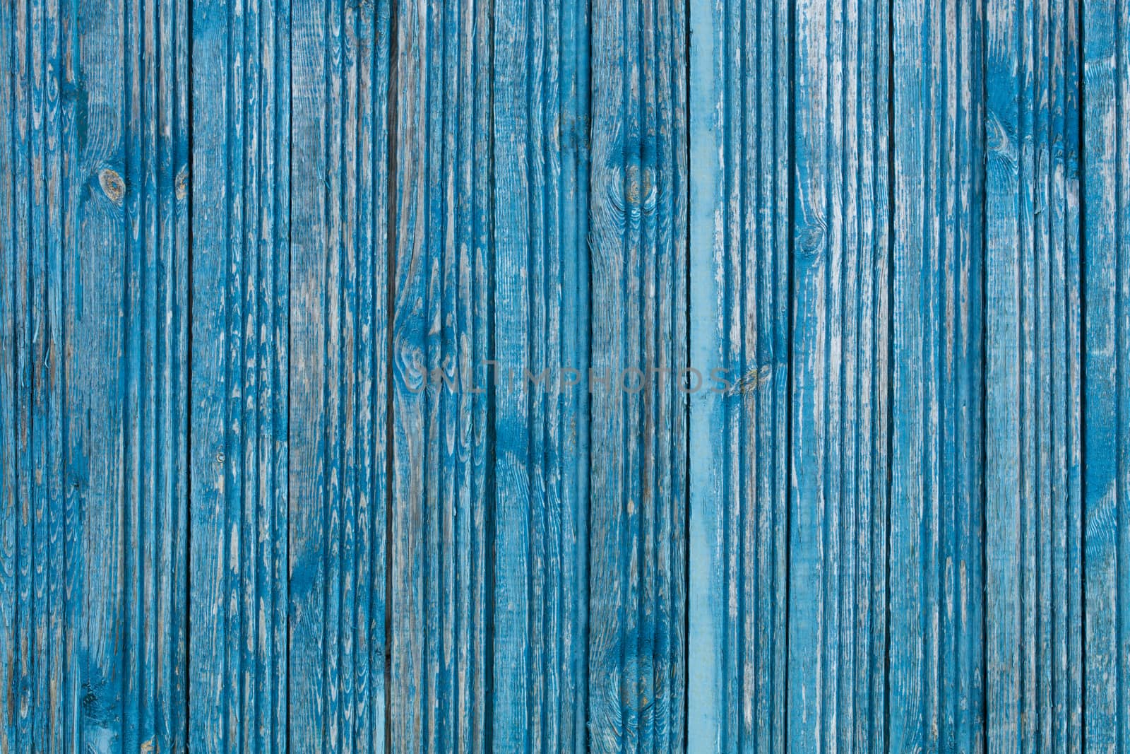 Shabby blue paint on old wooden boards and wood texture