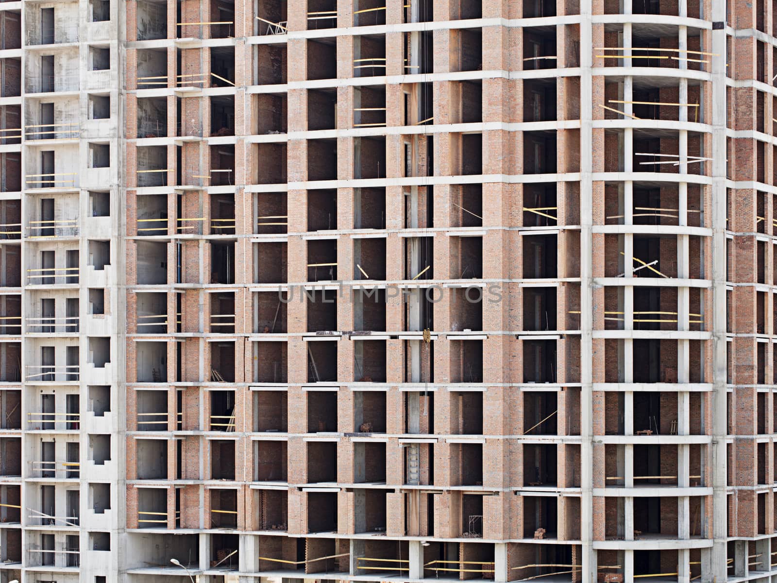Monolithic frame construction on facade - building under construction. by Sergii