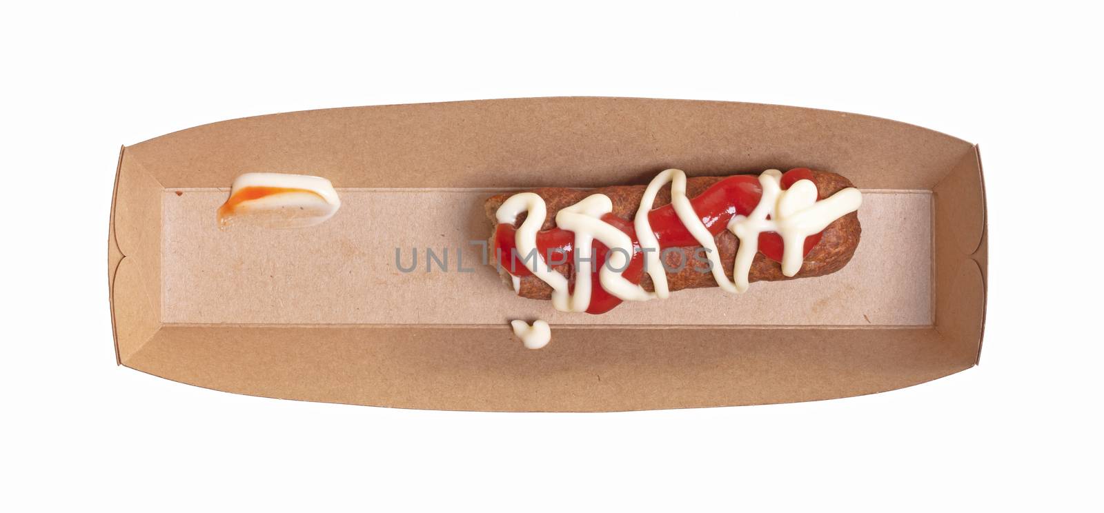 One frikadel with ketchup and mayonnaise, a Dutch fast food snack on a paper tray, half eaten