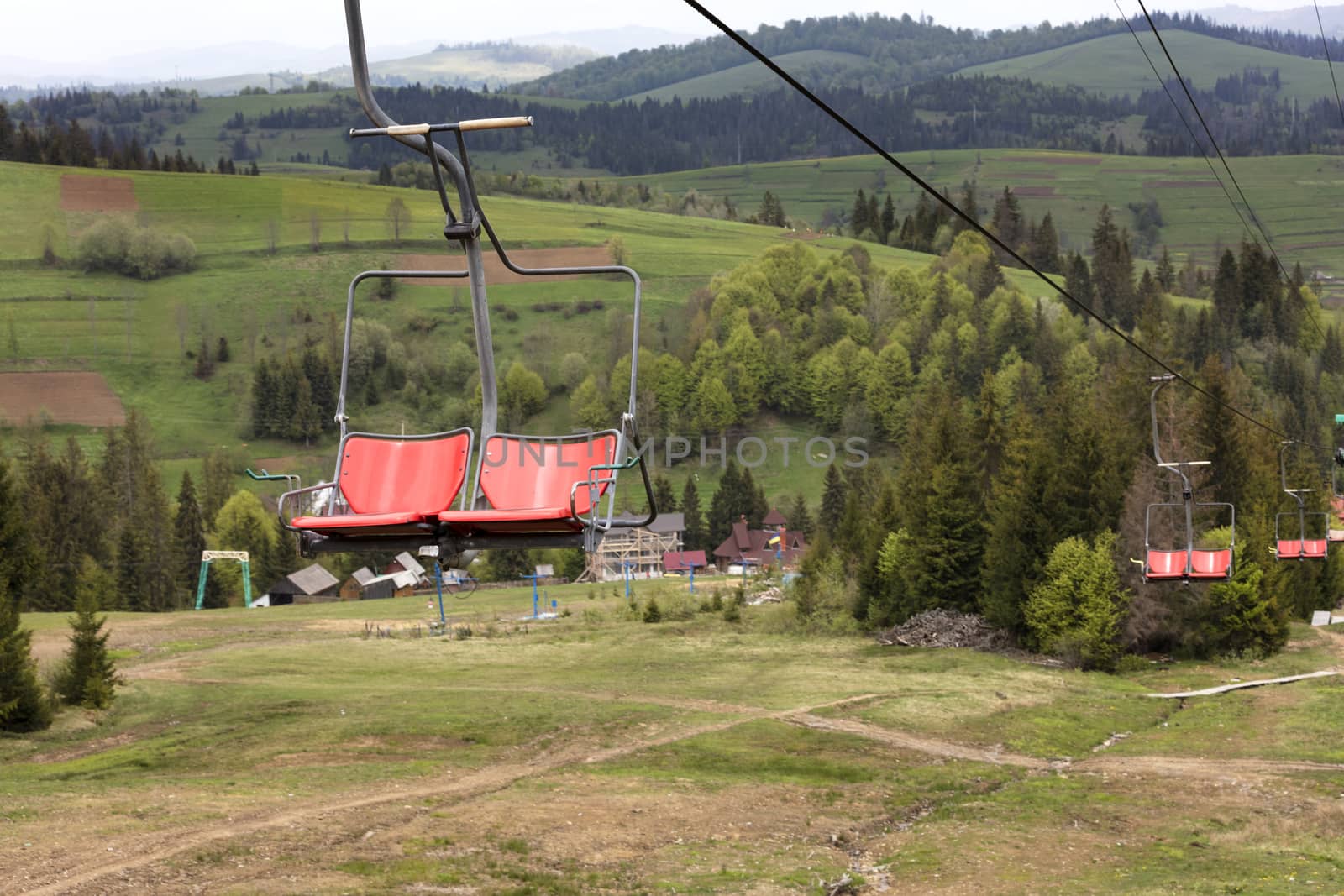 Chairlift with a mountain landscape of the Karpat mountains by Sergii