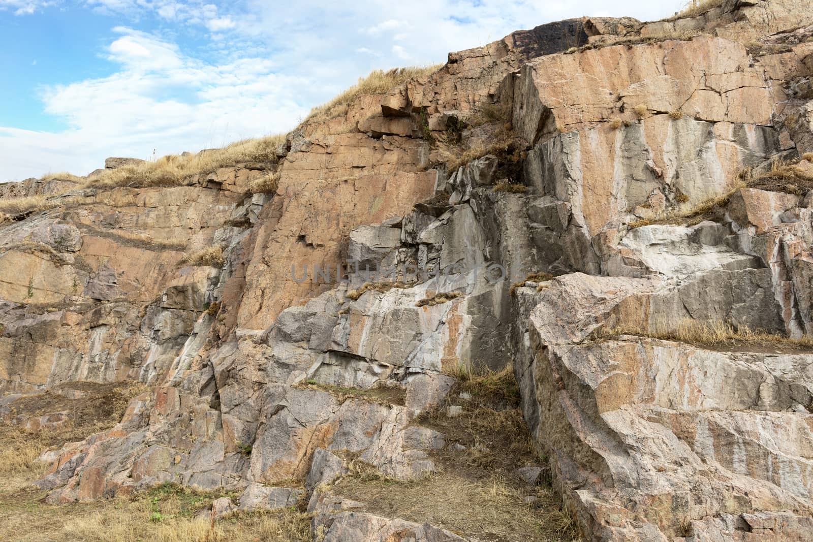 Granite and basalt rock formations against the background of a deep blue sky