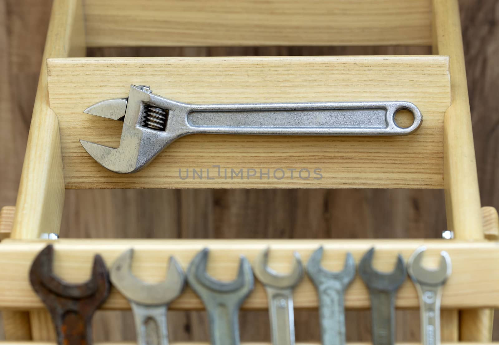 Old Construction tools on wooden slats close-up by Sergii