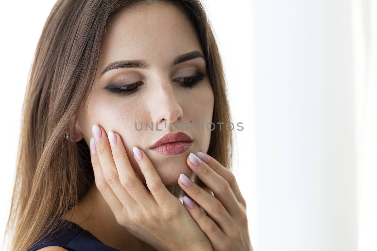 Beautiful woman's nails with beautiful french manicure ombre by Sergii