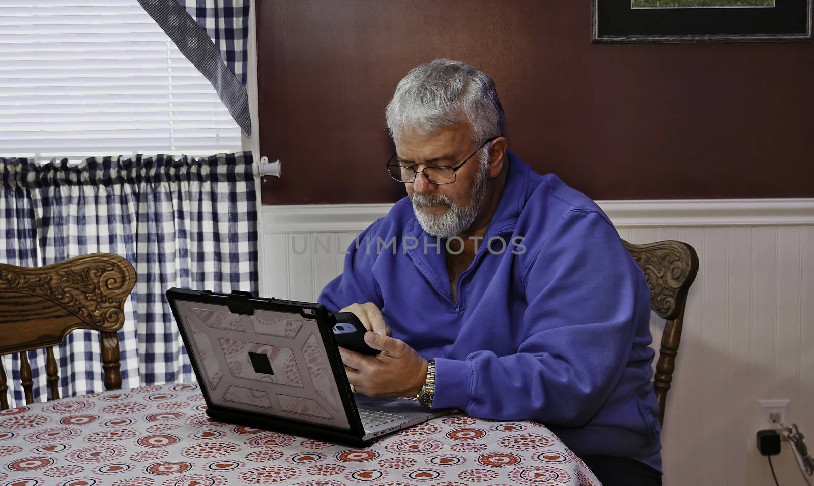 Senior Citizen Happy Texting on his Phone by actionphoto50
