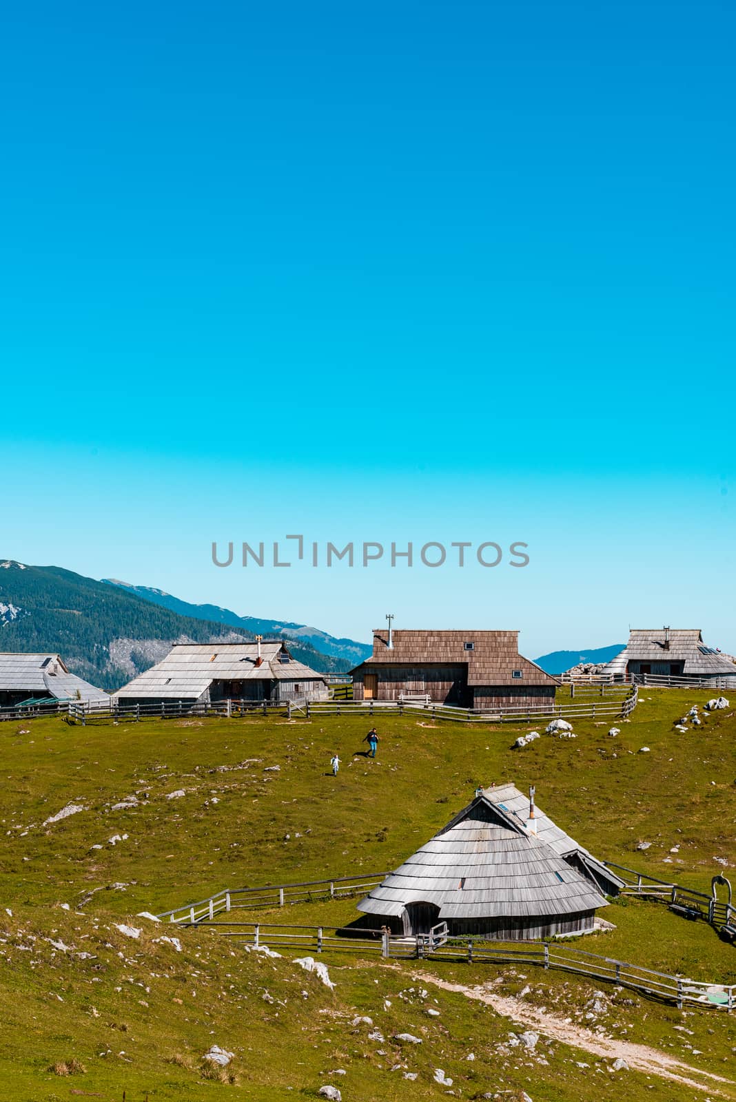 Big Pasture Plateau or Velika Planina in Slovenia. traditional Wooden Shepherd Shelters in Mountains.