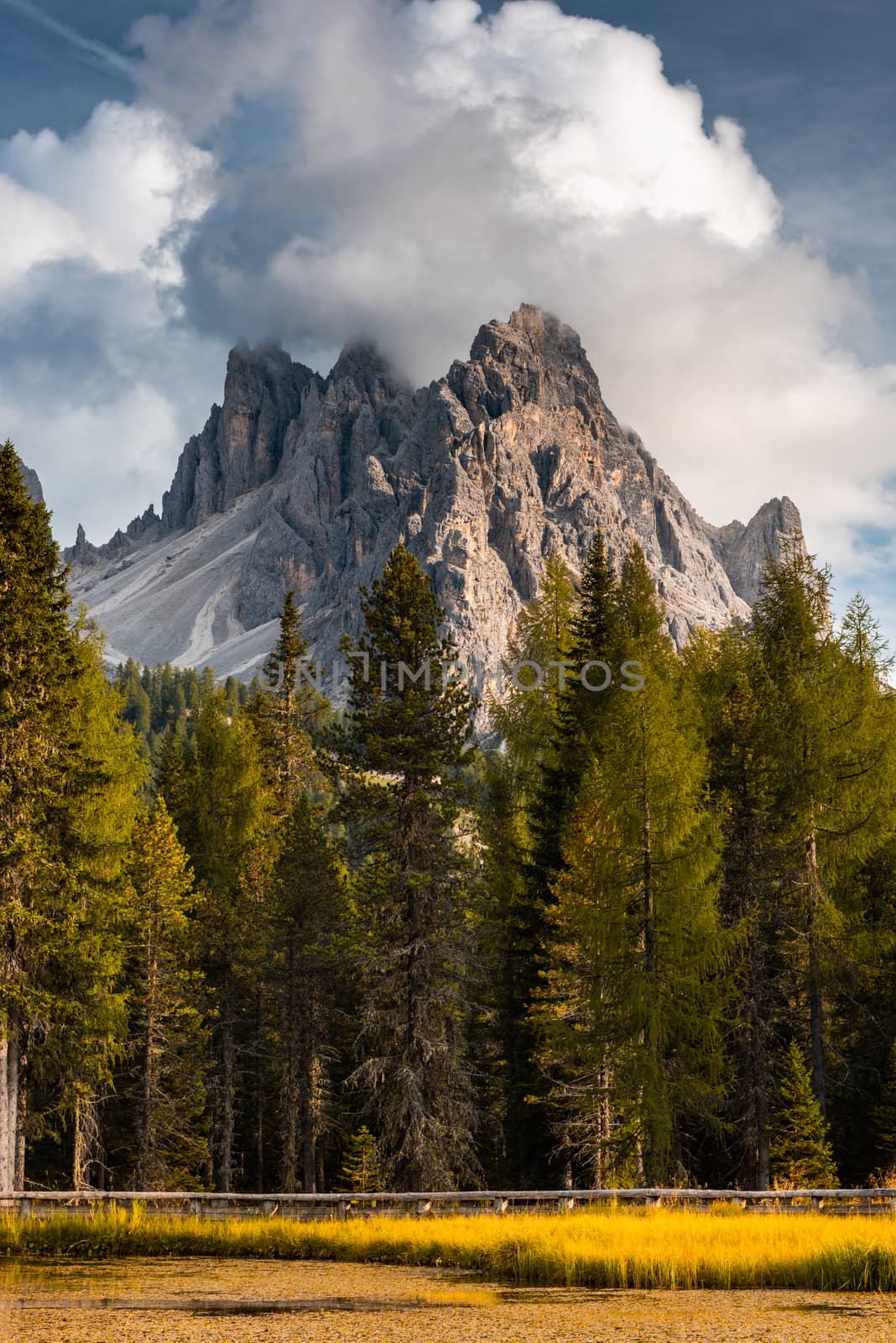 Italian Dolomites Dramatic Peaks at Lake Antorno at Fall Season.