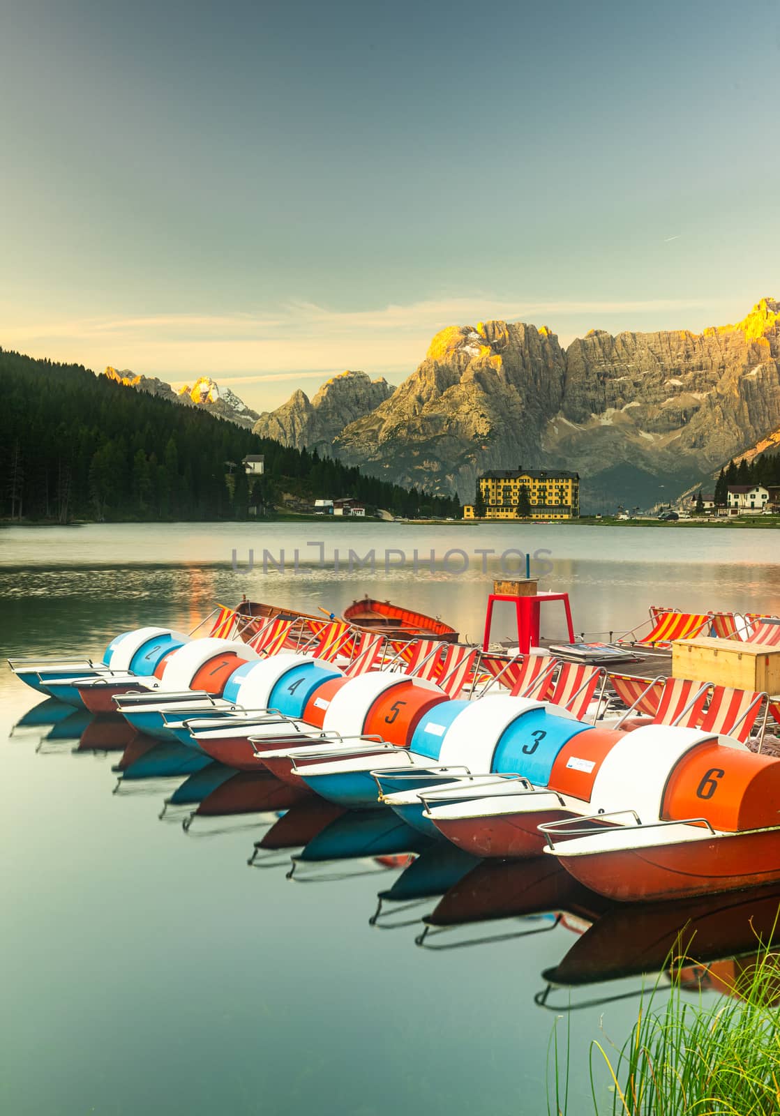 Vibrant Boats at Lake Misurina at Beautiful Sunrise in Dolomites, Italy.