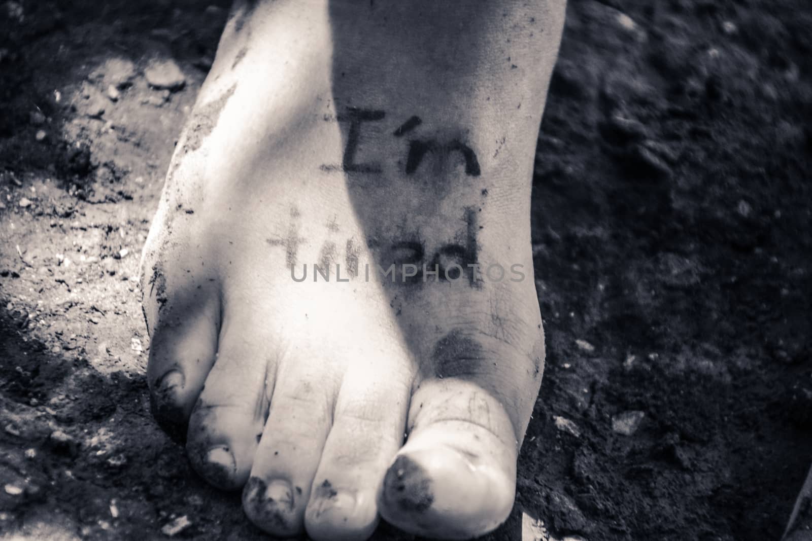 Photograph of a human feet and the phrase: Im tired