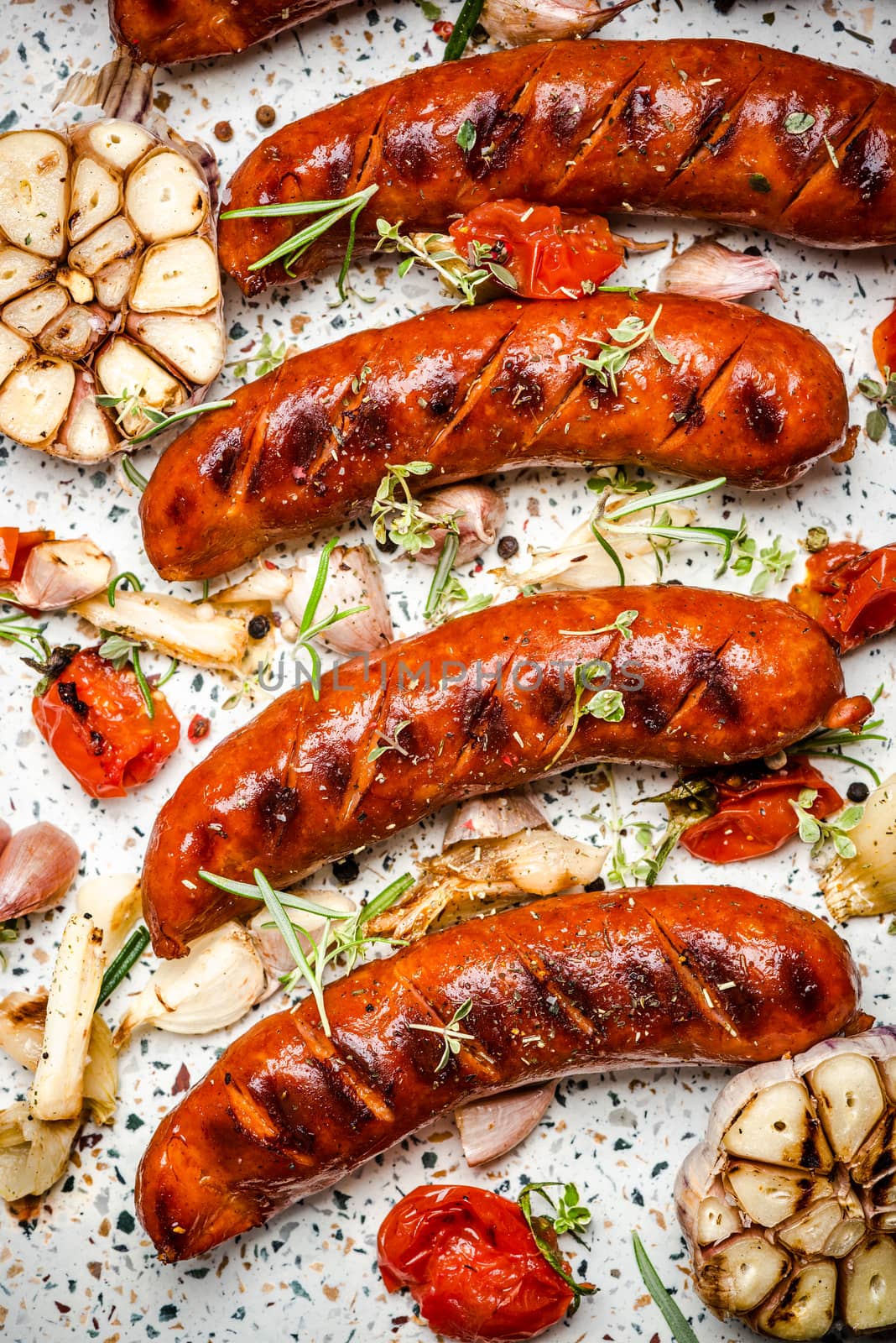 Serving Grilled Barbecue Sausage with BBQ Vegetables and Herbs.