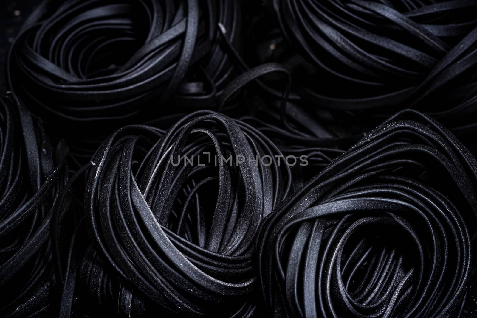 Squid Ink Black Pasta Spaghetti. Close Up View. Food Background.