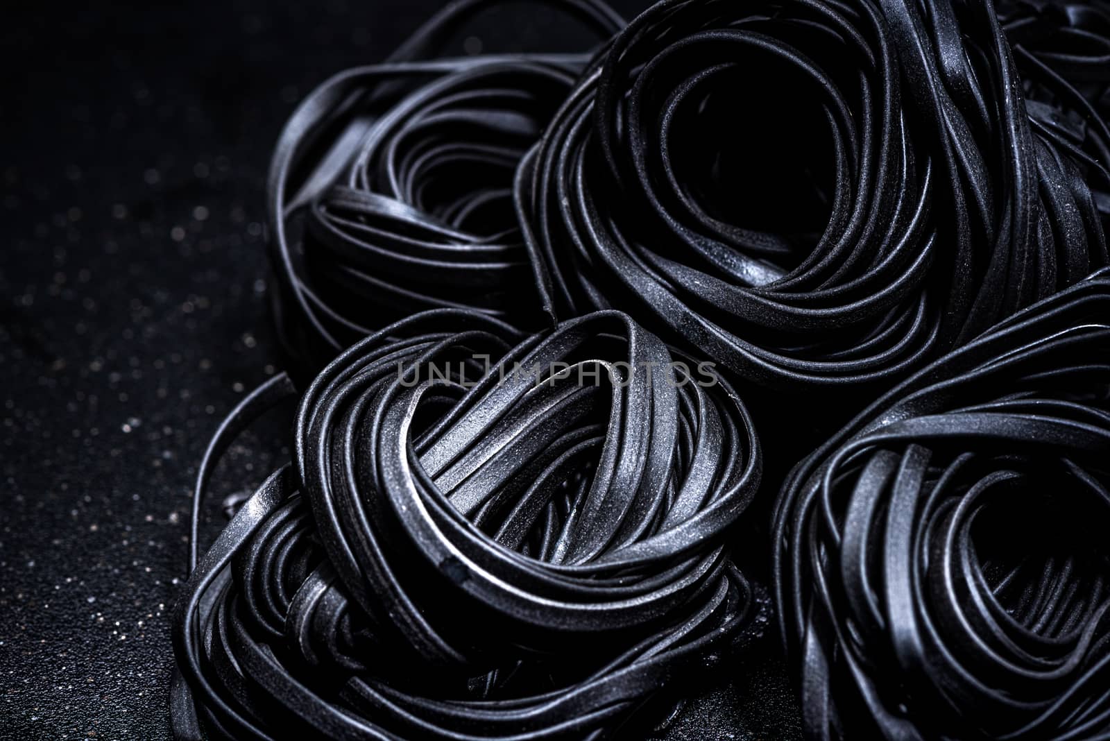 Squid Ink Black Pasta Spaghetti. Close Up View. Food Background.