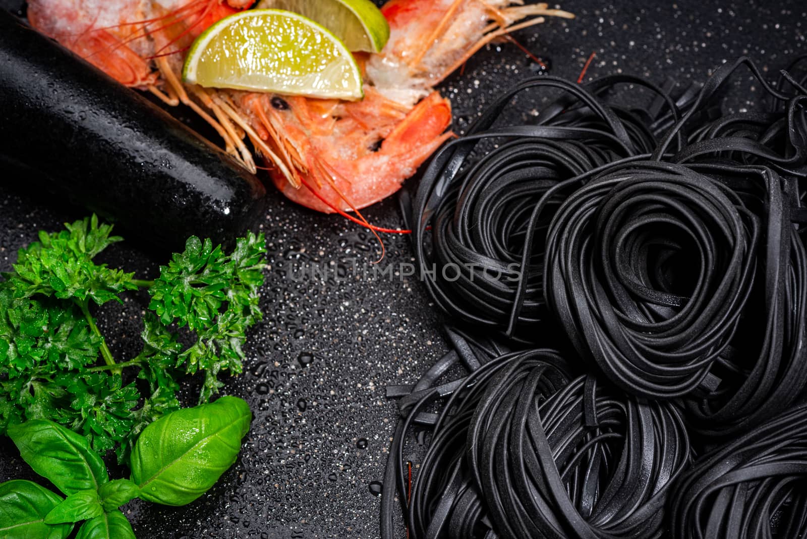 Black Squid Ink Pasta. Black Noodles and Shrimps, Prawns and Fresh Herbs.