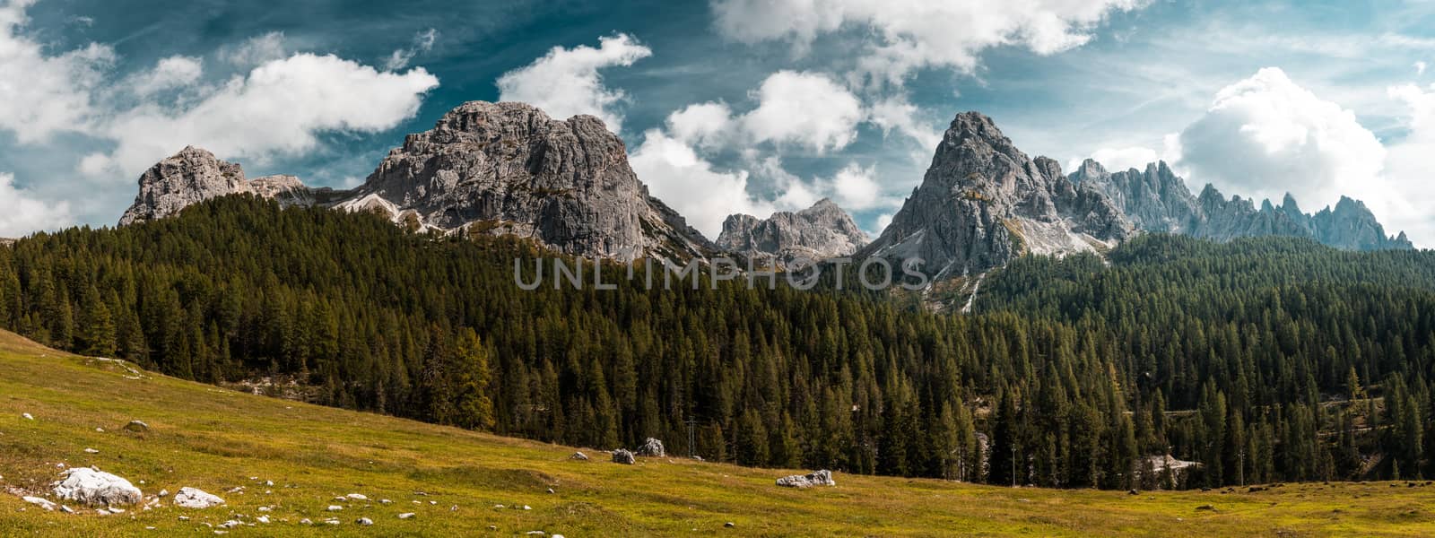 Tre Cimes di Lavaredo. Outdoor Adventure Wide Stitched Panorama. Panoramic Image of Italian Alps.