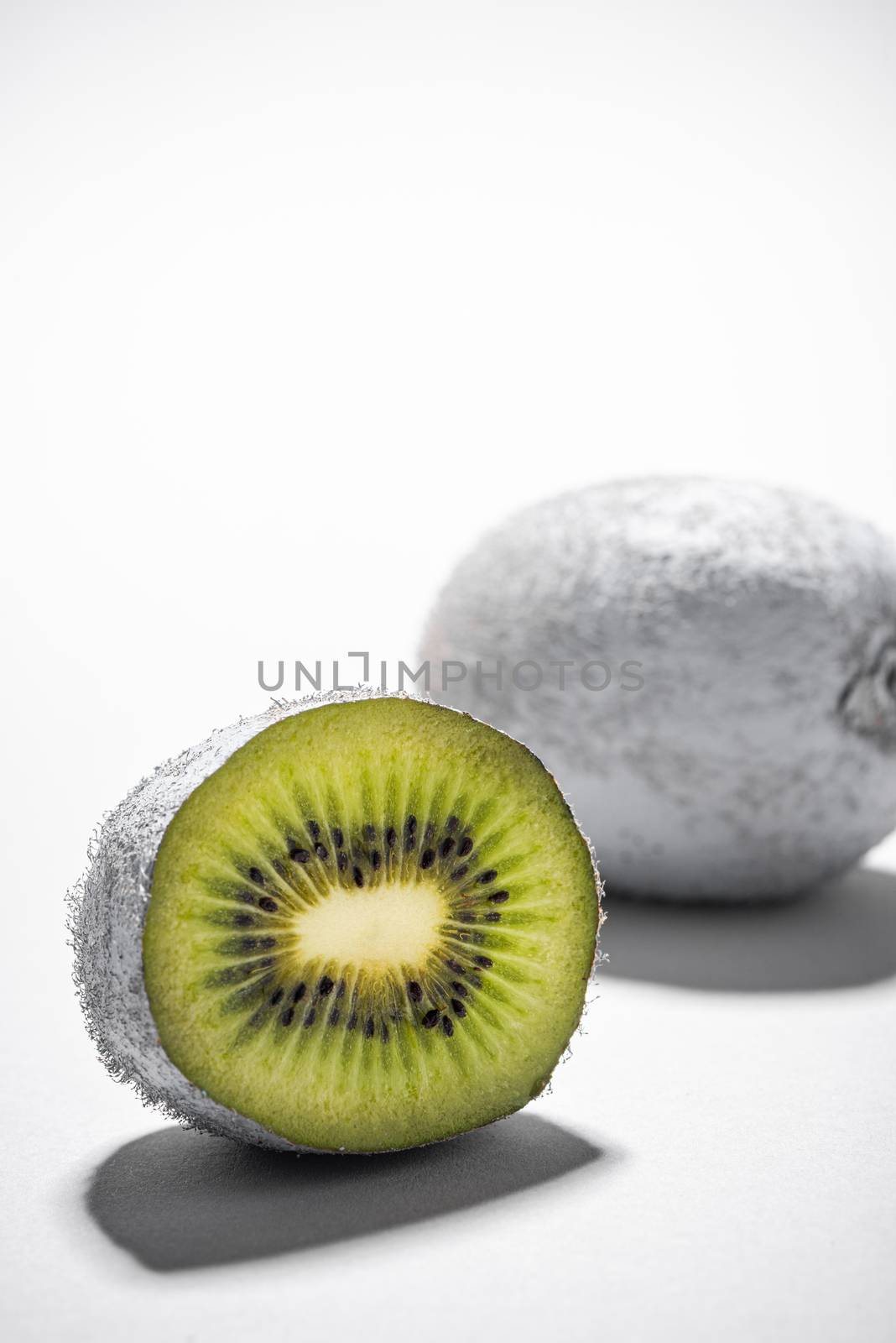 Modern Food Design. Monochrome Painted Kiwi Fruit Whole and Cut. Abstract Food Background.