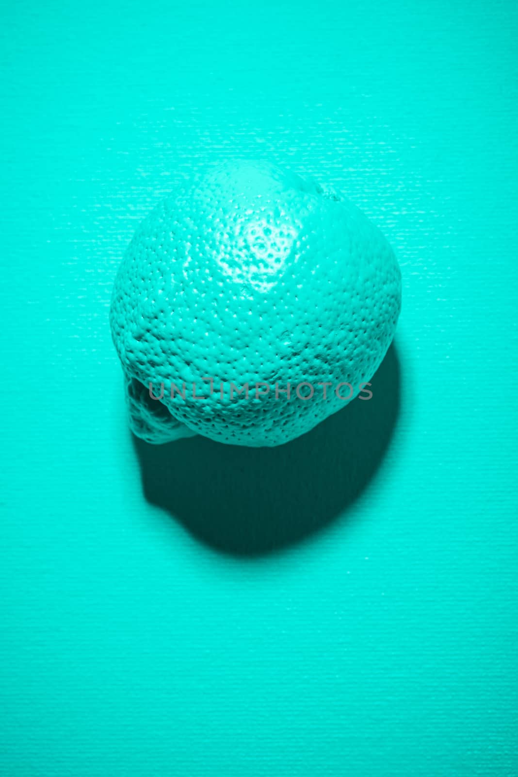 Abstract Lemon Fruit Painted in Pastel Blue on Blue Background. Minimal Art Food Background.