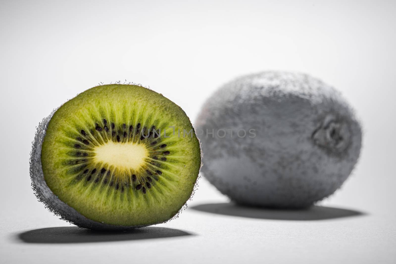 Modern Food Design. Monochrome Painted Kiwi Fruit Whole and Cut. Abstract Food Background.