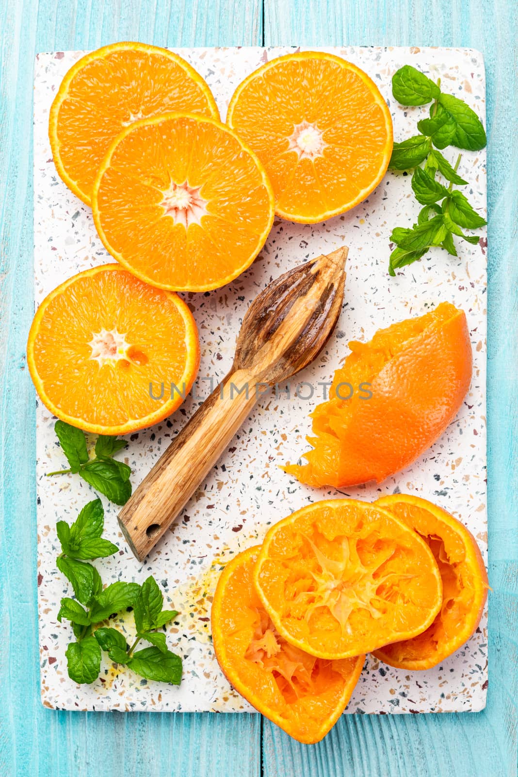 Orange Juice. Making Orange Juice with Wooden Squeezer. Top Down View. Healthy Eating Concept.