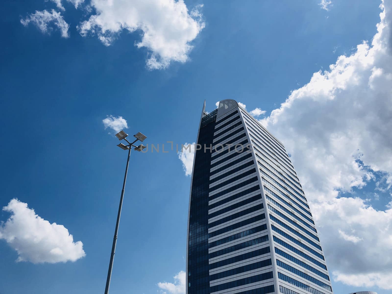 Tall business building in a bright day with clear blue sky